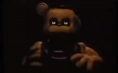 Freddy The Bear Holding Remote GIF