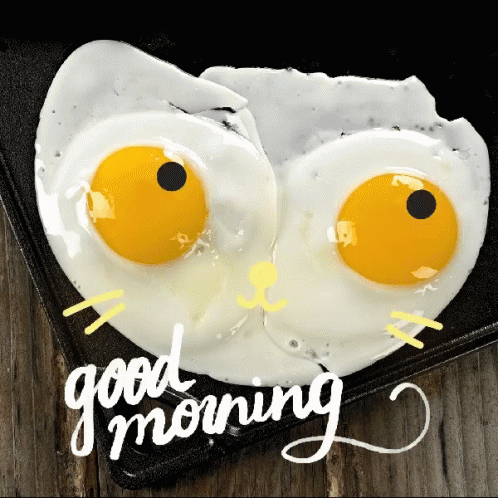 Fried Eggs With Googly Eyes And The Words Good Morning Written Below Them GIF