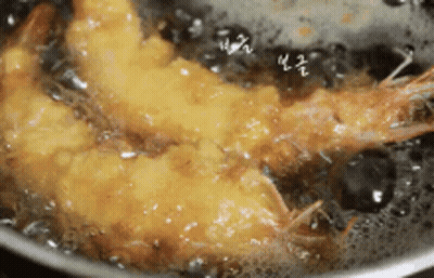 Fried Shrimp Cooking in Pot of Oil