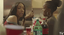 Friends Talking At African American Christmas Party GIF