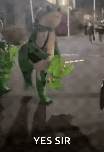 Frog In Green Costume Walking Down Street Saying Yes Sir GIF