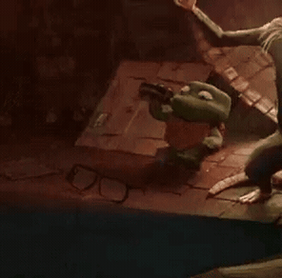 Frog With Glasses Sitting Beside Another On Brick Floor GIF