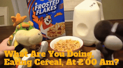 Frosted Flakes Cereal Box Next To Bowl GIF