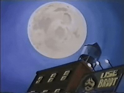 Full Moon Over Building With Water Tower GIF