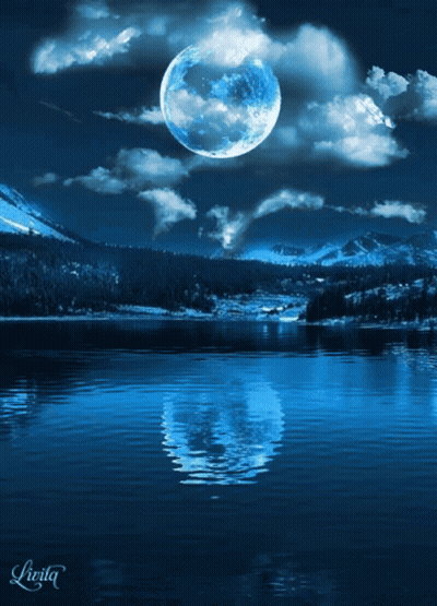 Full Moon Reflected In Water With Mountains GIF