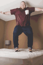 Fully Grown Man Jumping On The Bed GIF