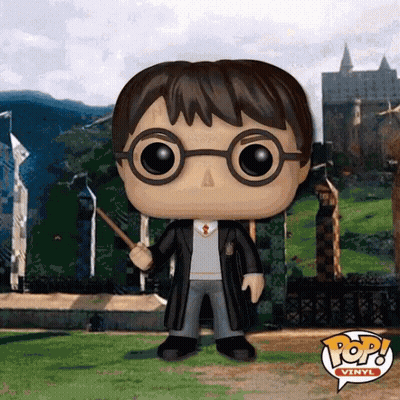 Funko Pop Harry Potter Holding Wand In Front Of Castle GIF