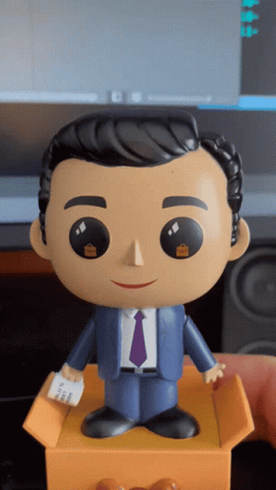 Funko Pop In Suit And Tie Holding Receipt GIF