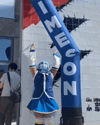Funny Girl Dancing With Inflatable Tube Man GIF