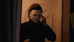 Funny Halloween Killer Calling Nodding GIF