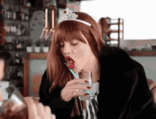 Funny Lady Wearing Crown  Sucking Straw GIF