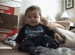 Funny Laughing Baby Rolling On Floor GIF