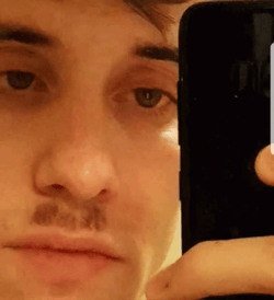 Funny Man Donning Hitler Mustache GIF