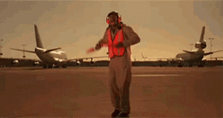 Funny Runway Worker Dance While Guiding Plane GIF