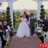 Funny Wedding Couple Dancing On The Aisle GIF
