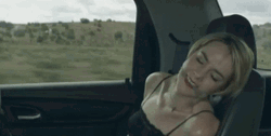 Gagged Woman Laughing In A Car GIF