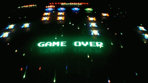 Game Over Is Displayed On A Screen In The Dark GIF
