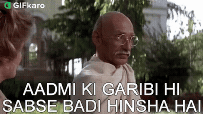 Gandhi In Garden With Glasses Talking To Woman GIF