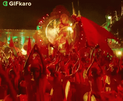 Ganesha Statue Surrounded By Crowd GIF