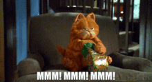 Garfield Cat Eating Snacks Mmmm Hungry GIF
