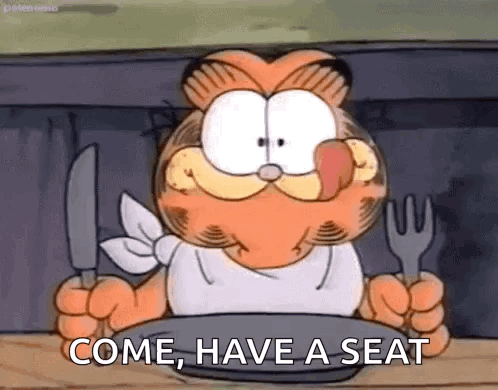 Garfield Is Holding A Knife And Fork And A Plate Of Food . GIF
