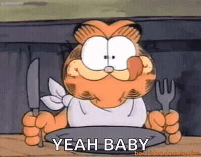 Garfield Is Holding A Knife And Fork In Front Of A Plate And Says Yeah Baby GIF