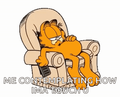 Garfield Is Laying In A Chair With A Remote Control In His Hand GIF