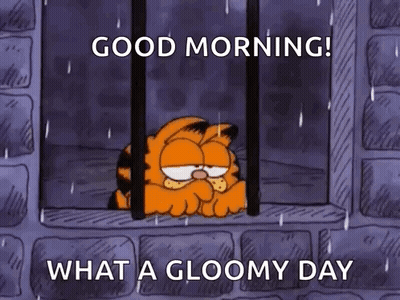 Garfield Is Sitting In A Prison Cell Looking Out The Window . GIF