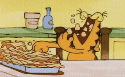 Garfield Sitting On Counter With Eyes Closed GIF