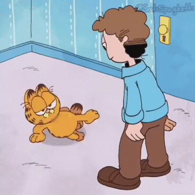 Garfield The Cat Is Standing Next To A Man In A Blue Shirt In A Room . GIF