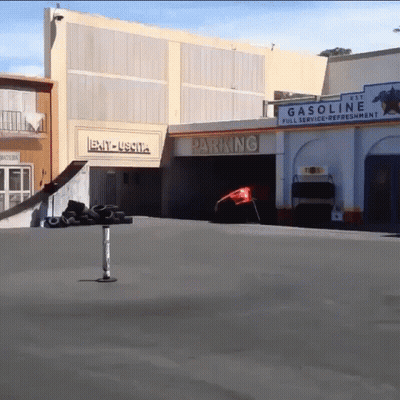 Gas Station With Parking Sign GIF