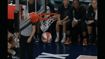 Gatorade Bucket on Rack Next to Basketball Net