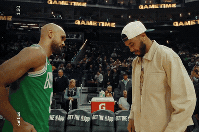 Gatorade Cooler Between Two Basketball Players GIF