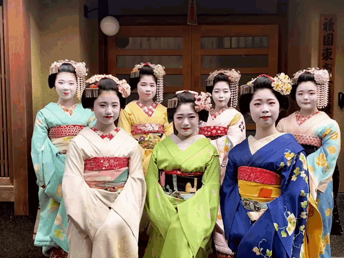 Geishas Posing For Photo In Front Of Building GIF