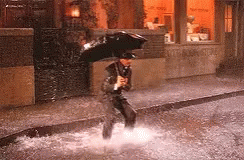 Gene Kelly Jumping On Puddles Songing In The Rain GIF
