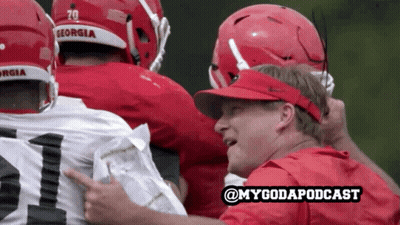 Georgia Football Huddle With Man In Red Shirt Pointing GIF