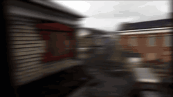 Ghost Town With Neglected Vehicles GIF
