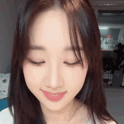 Ghost With Flowers In Mouth Saying Spooky GIF