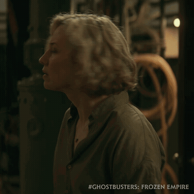 Ghostbusters Frozen Empire Poster Woman In Green Shirt GIF