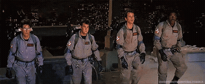 Ghostbusters Walking In Front Of City At Night GIF