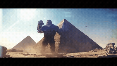 Giant Monster In Desert With Pyramid GIF