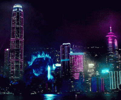 Giant Monster Standing Before City Skyline At Night GIF