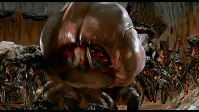 Giant Monster With Huge Mouth Surrounded By Smaller Monsters GIF