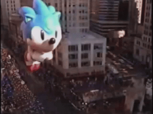 Giant Sonic The Hedgehog Balloon Flying Through City GIF