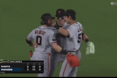 Giants And Dodgers Baseball Players Celebrate A Win GIF