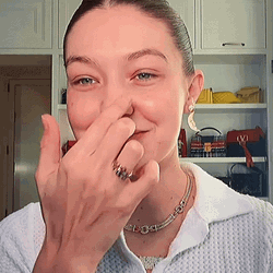 Gigi Hadid Squeezing Her Face GIF