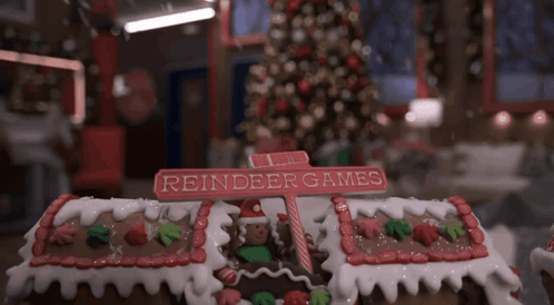 Gingerbread House Reindeer Games Sign GIF