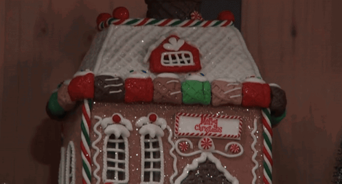 Gingerbread House Saying Merry Christmas GIF