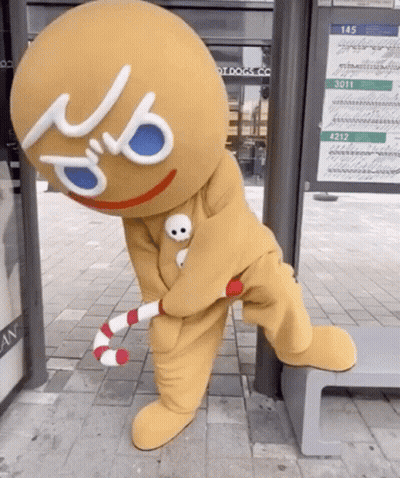 Gingerbread Man Holding Candy Cane GIF