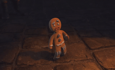 Gingerbread Man Standing On Brick Floor GIF